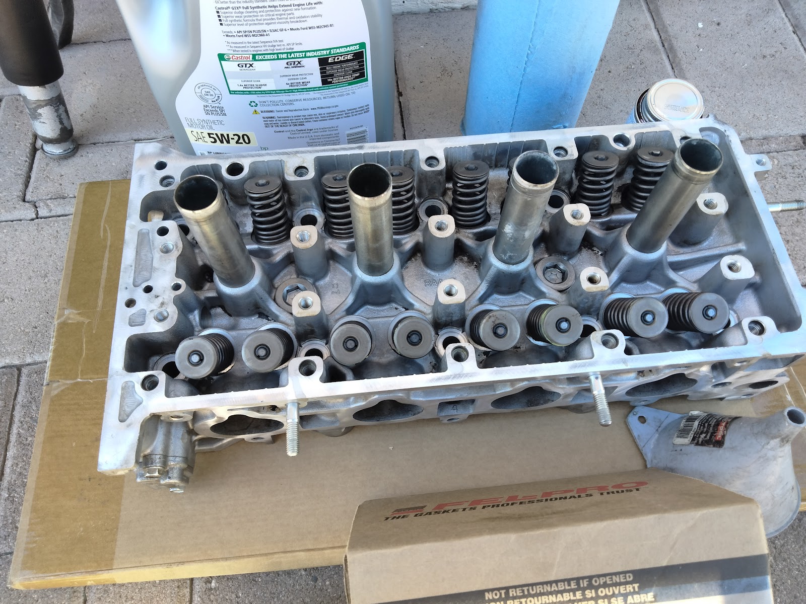 A cylinder head out of the car for service, valve gear exposed